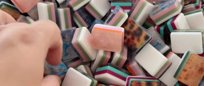 Close-up of colorful physical mahjong tiles for custom tabletop product manufacturing
